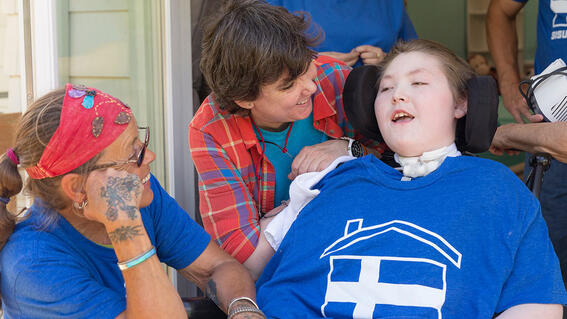 Noah, his mom and a volunteer