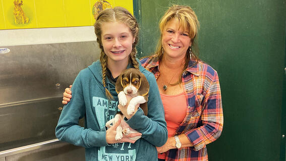 Hannah is all smiles as she holds Oscar.