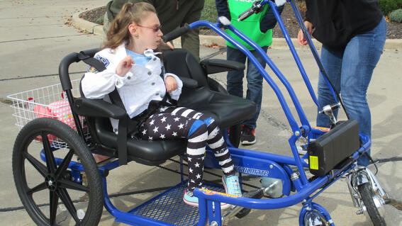 Emili receiving her bike
