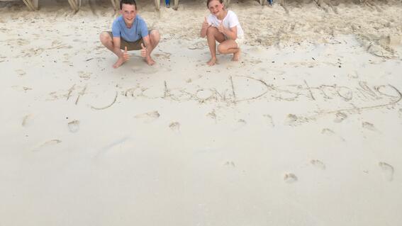 Jackson on the beach with his #jacksonDstrong