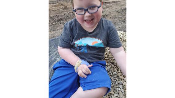 Greyson playing in backyard