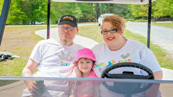 Izzy with her mom and dad