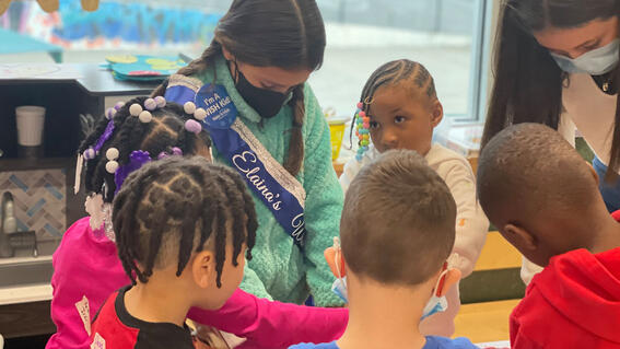 Elaina delivers toys to kids