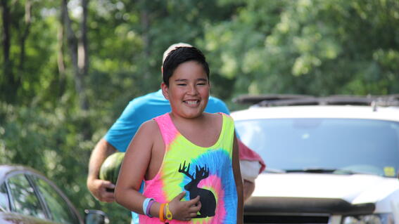 Nico running to his kayak 