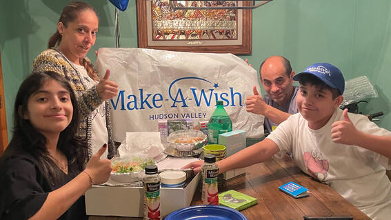Mateo and his family celebrating his wish