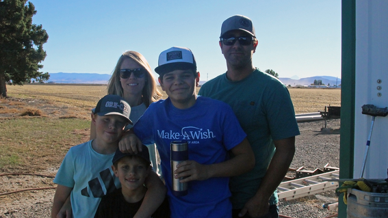 Miles with his parents, Nick and Natalie; his younger brothers, Clayton and Ben.