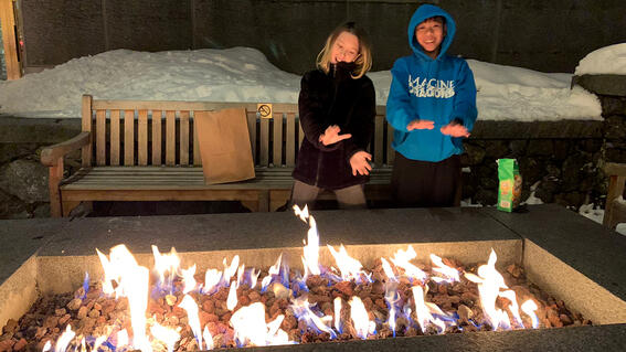 Yuval and friend at fire pit