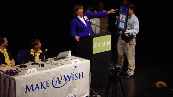 Ben receiving an award at the launch of Ben's Game on his wish day celebration in 2004.