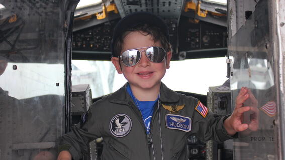 hudson posing in cockpit