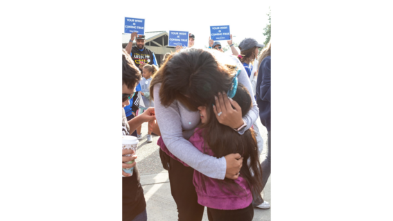 Wish kid Bridget hugs her mom, Isabel. 
