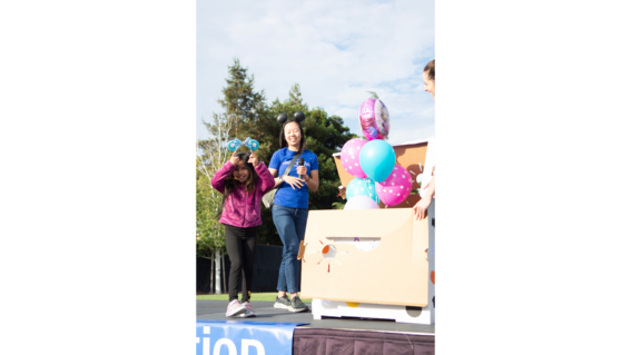 Bridget on stage for her wish reveal at 2024 Walk for Wishes. 