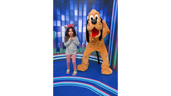Bridget posing with Pluto. 
