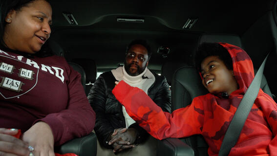 Austin and his parents in the car