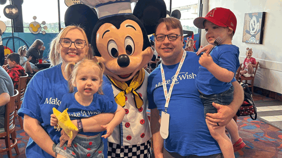 Lucas and his family with Chef Mickey