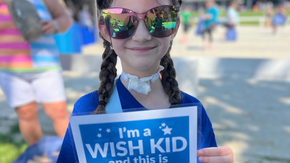 Ella holding wish kid sign