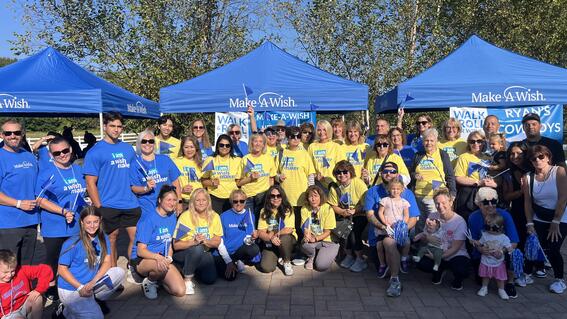 Image shows a group of volunteers posing for a photo