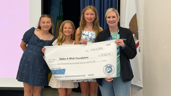 Students from Patton Elementary present donation check