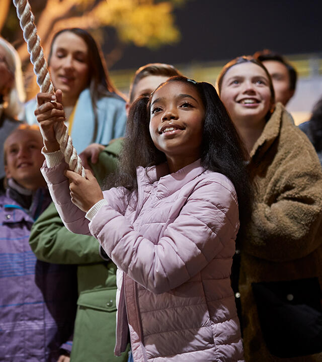 Young girl surrounded by community