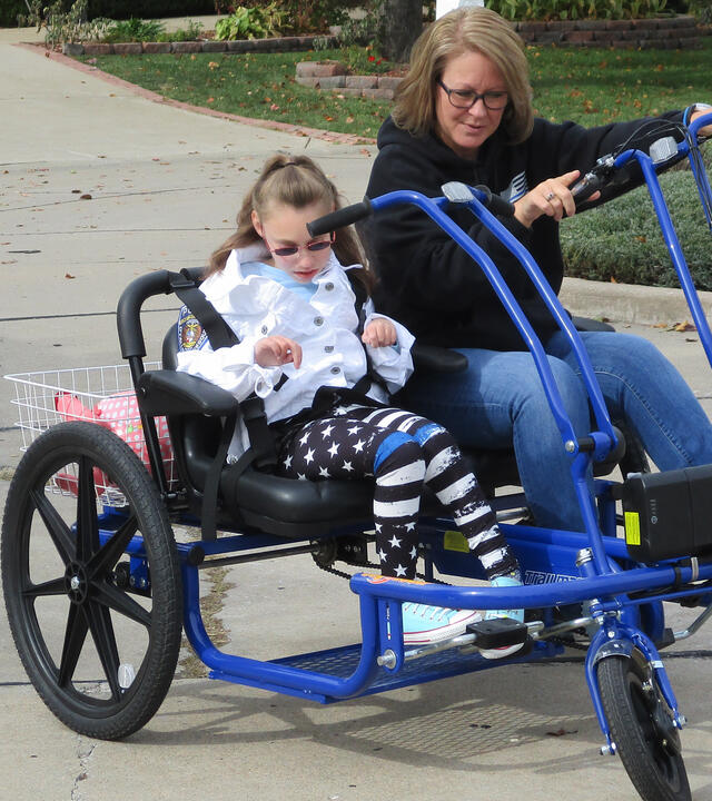 Emili and her mother on her bike