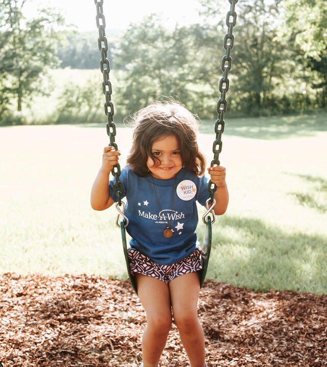 Johanna swinging in her swing 