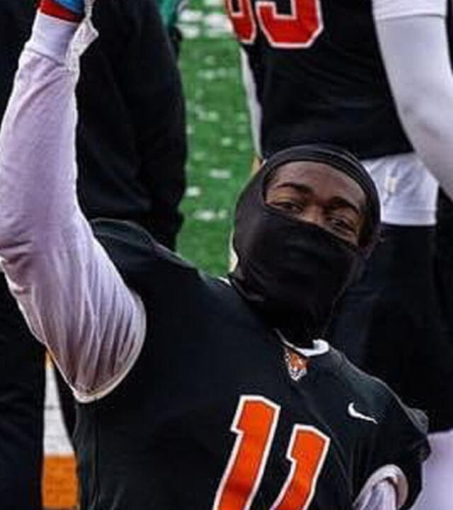 Tariq on a football field
