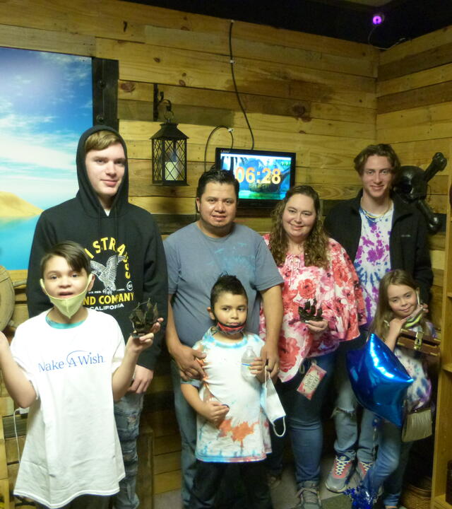 Wish kid Levi and his family enjoying their escape room surprise
