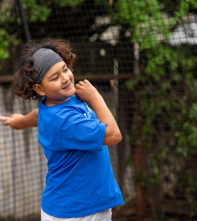 An action shot of Fernie right after he hit a pitch thrown at him