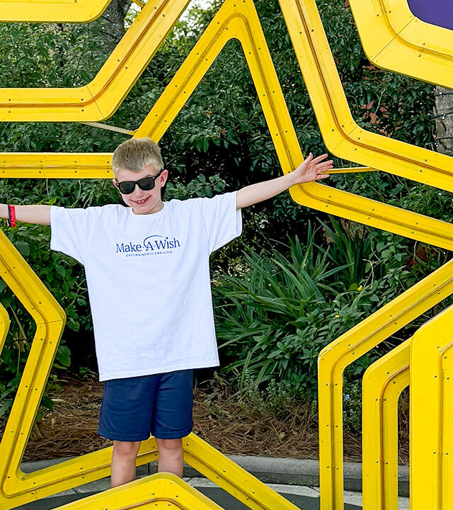 Wish Kid Noah smiles at Give Kids the World Village