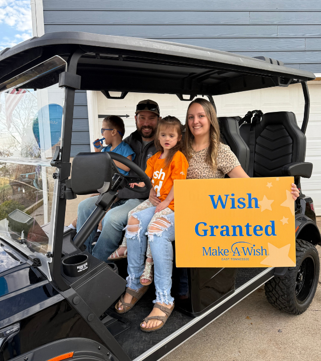 wish family in golf cart