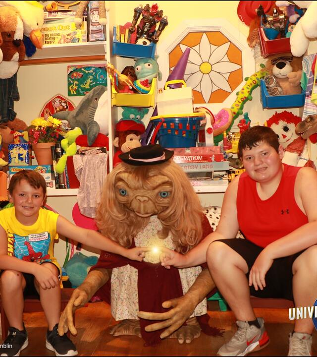 Jaxon and his younger brother posting with ET at Disney World