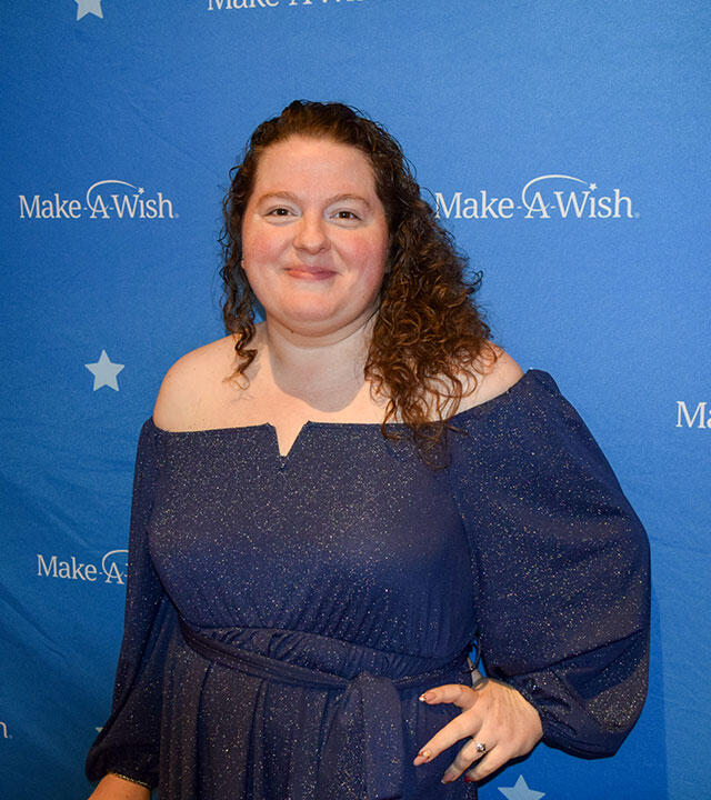 Rebecca in front of Make-A-Wish Background