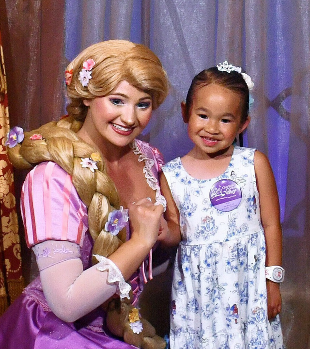 Wish kid Riley with Princess Rapunzel