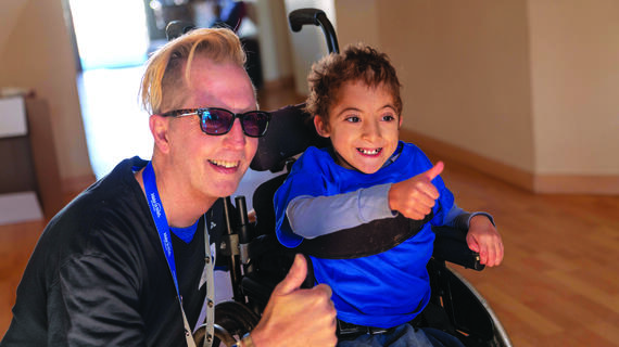 Wish kid Sultan with volunteer Jimmy