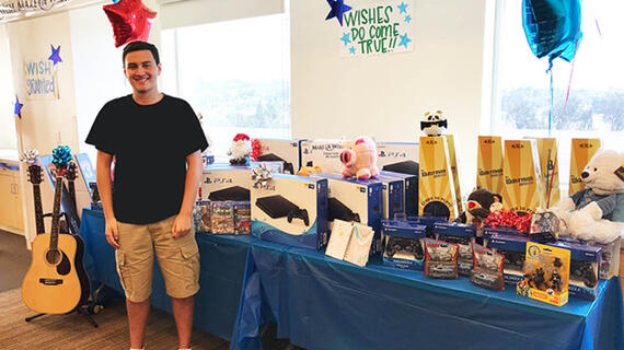 Matthew in hospital with give away toys