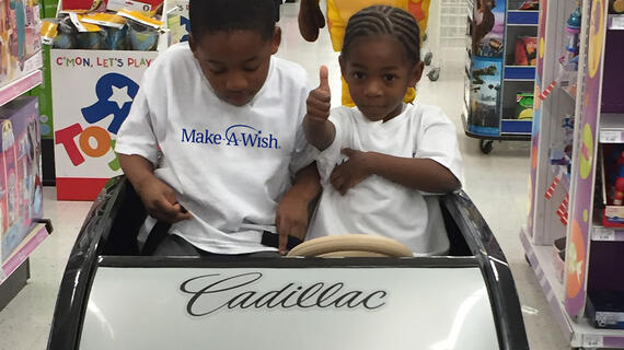 Zion and his brother cruise through the toy store. 