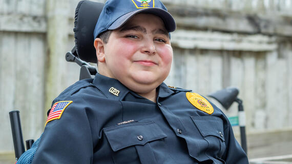 Evan decked out in his Oneida Police uniform