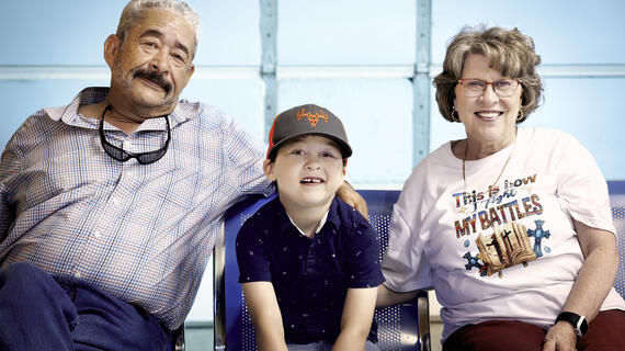 Wish kid Axel hanging out in his backyard barn with his grandparents. 