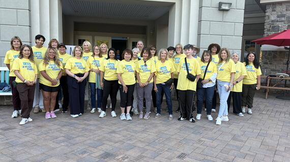 Image shows a group of volunteers posing for a photo