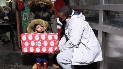 Khari Edwards with child in Hospital