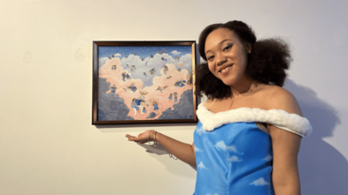 adult appearing young woman (Katina) standing next to hear artwork creation