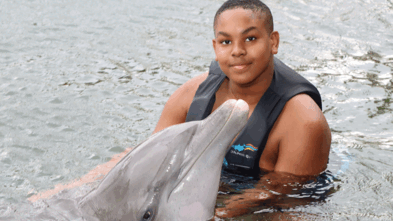 Khamari with a dolphin