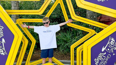 Wish Kid Noah smiles at Give Kids the World Village