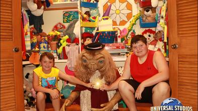 Jaxon and his younger brother posting with ET at Disney World