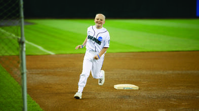 Katie Morris runs the bases at the Mariners Game