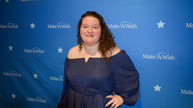 Rebecca in front of Make-A-Wish Background