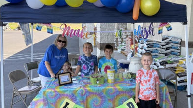 Volunteer Vickie and grandkids hosting a lemonade stand
