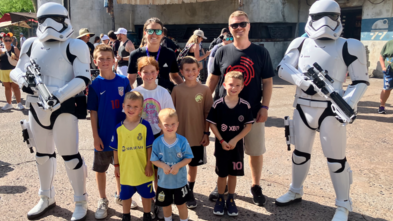 Knox and family posing with storm troopers at Disney