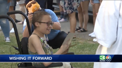 Sammie inside Land Park attending a celebration in her honor with family and friends