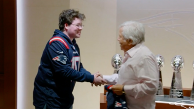 Ben shaking Robert Kraft's hand.