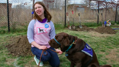 Allison plants trees on the Newburyport rail trail.